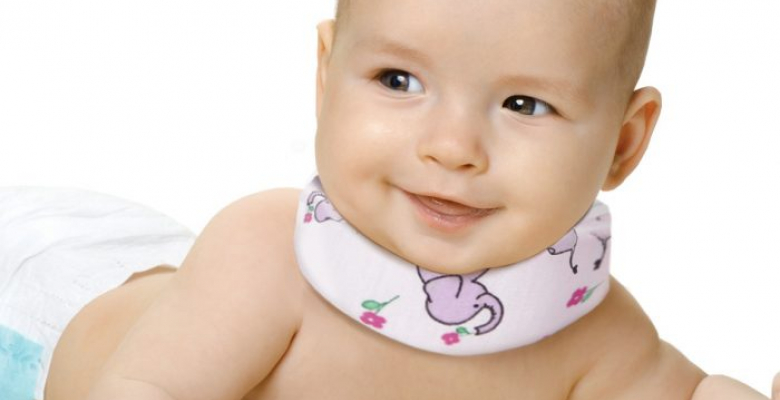 the very beautiful little baby , lie on stomach and crawl, on white background, isolated