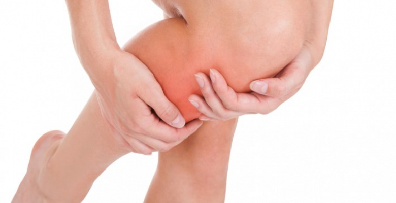 Close up of woman leg injury isolated on white background