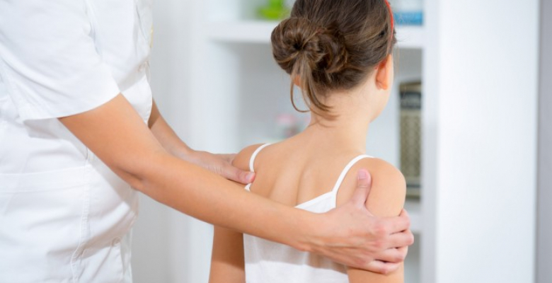 Chiropractor doing adjustment on female patient