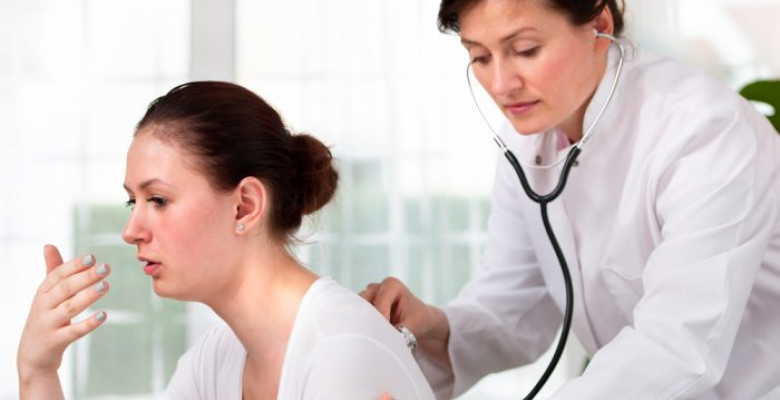 female doctor examines a young man colds